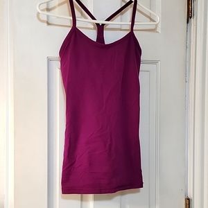 Lululemon tank,  size 4, in good used condition.  Comes with removable bra pads